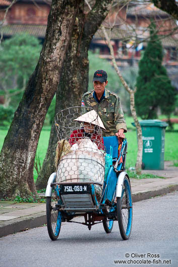 Hue man and woman on bike 