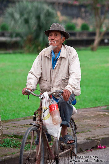 Hue man on bike 