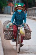 Travel photography:Hoi An woman on bike , Vietnam