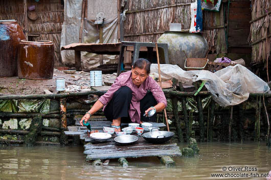 Washing the dishes in the Mekong near Can Tho 