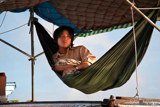 Having a rest aboard his ship near Can Tho