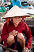 Travel photography:Woman at the Can Tho Floating Market , Vietnam