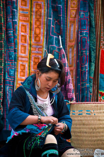 Hmong girl sewing in Sapa 