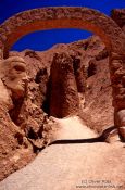 Travel photography:Stone face and arch in the old Inca settlement of Pukará de Quitor near San Pedro de Atacama, Chile