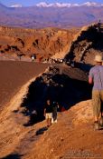 Travel photography:People walking on sand dune near the Valley de la Luna, San Pedro de Atacama, Chile